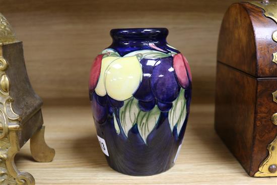 A Moorcroft vase wisteria and fruits Height 16cm